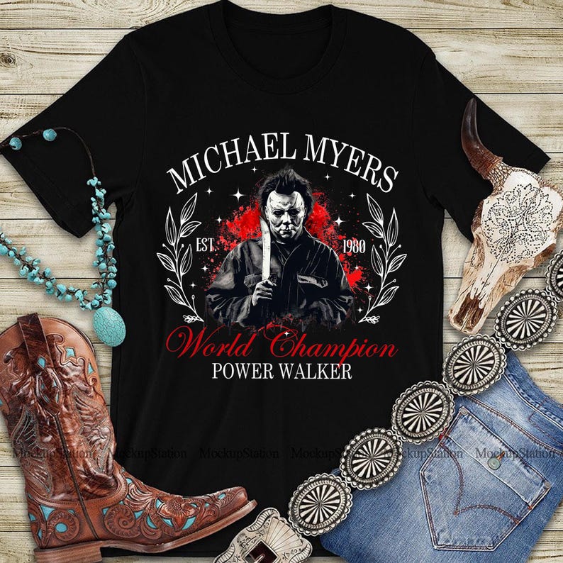 May include: Black t-shirt with a graphic of Michael Myers holding a knife, the text reads "MICHAEL MYERS" above and "World Champion POWER WALKER" below. The design includes a red splatter effect and the year "1980".