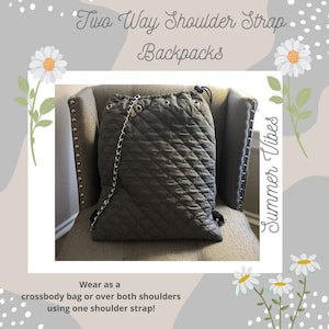 May include: A gray quilted drawstring backpack with a silver chain strap. The backpack is sitting on a gray chair with a studded back. The text "Two Way Shoulder Strap Backpacks" and "Summer Vibes" is visible in the image.
