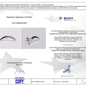 May include: A certificate of registration from the European Union Intellectual Property Office. The document includes the text "Certificate of Registration" and "Registered 12/07/2024". The certificate also shows a silver crescent-shaped earring.