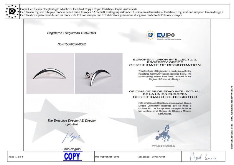 May include: A certificate of registration from the European Union Intellectual Property Office. The document includes the text "Certificate of Registration" and "Registered 12/07/2024". The certificate also shows a silver crescent-shaped earring.