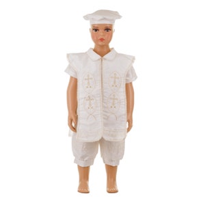May include: A white outfit for a young boy, featuring a short-sleeved shirt with a white collar, a vest with gold embroidery, and matching shorts. The outfit includes a white hat.