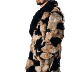 May include: A long, brown and black fur coat with a large collar. The coat is made of a patchwork of different fur pieces.