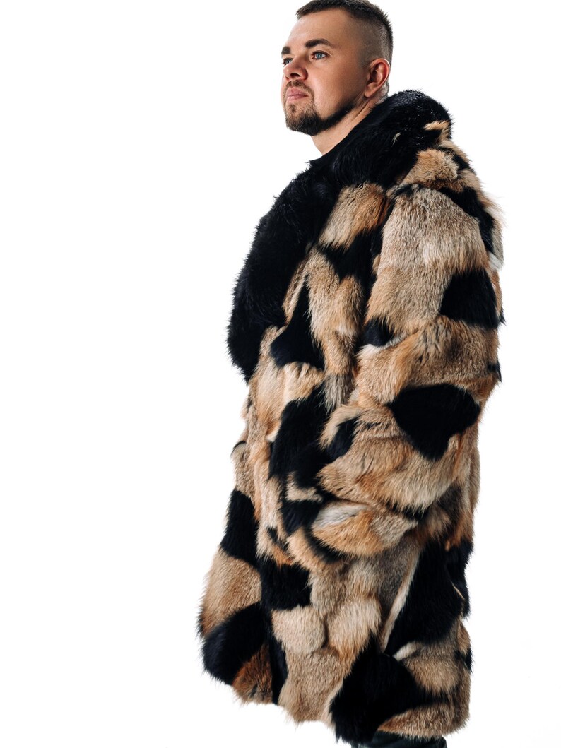 May include: A long, brown and black fur coat with a large collar. The coat is made of a patchwork of different fur pieces.