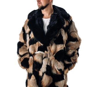 May include: A long, brown, black, and white fur coat with a large hood. The coat is made of different types of fur, creating a patchwork design.