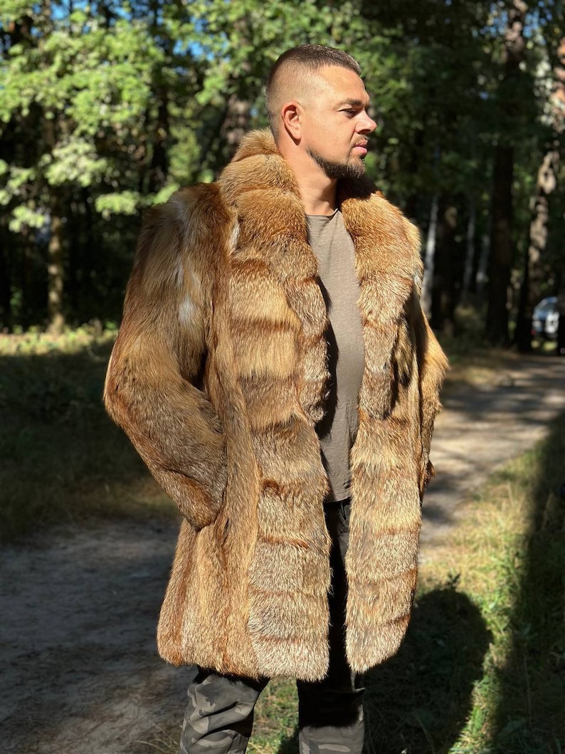May include: A long, brown fur coat with a collar. The coat is made of fox fur and has a natural, wild look.