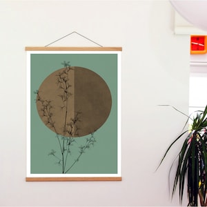 May include: A framed print with a minimalist design featuring a brown circle with a branch of delicate white flowers in front of it. The background is a muted teal green.