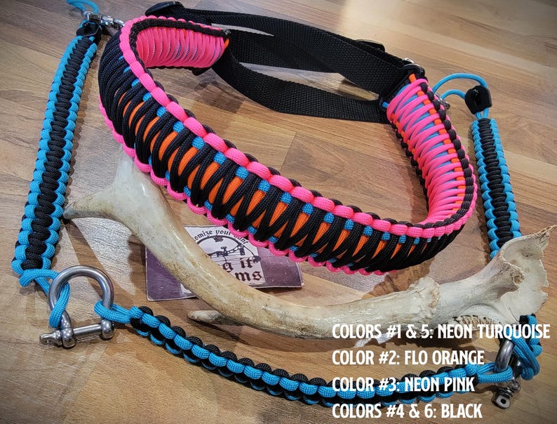 May include: A brightly coloured rifle sling made from paracord in neon turquoise, flo orange, neon pink, and black. The sling has a black strap and metal fixings. The image text reads: COLORS #1 & 5: NEON TURQUOISE, COLOR #2: FLO ORANGE, COLOR #3: NEON PINK, COLORS #4 & 6: BLACK.