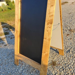 Large free standing chalkboard. Extra large sandwich sign, outdoor easel. Sidewalk display, built to last. Heavy duty, golden oak finish.