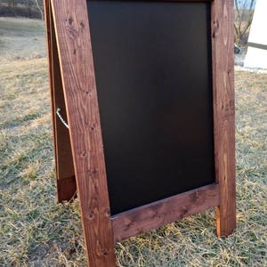A-frame sandwich chalkboard. Red oak finish, standing sidewalk chalk board. Double sided, 2 sided A-frame rustic farmhouse easel.