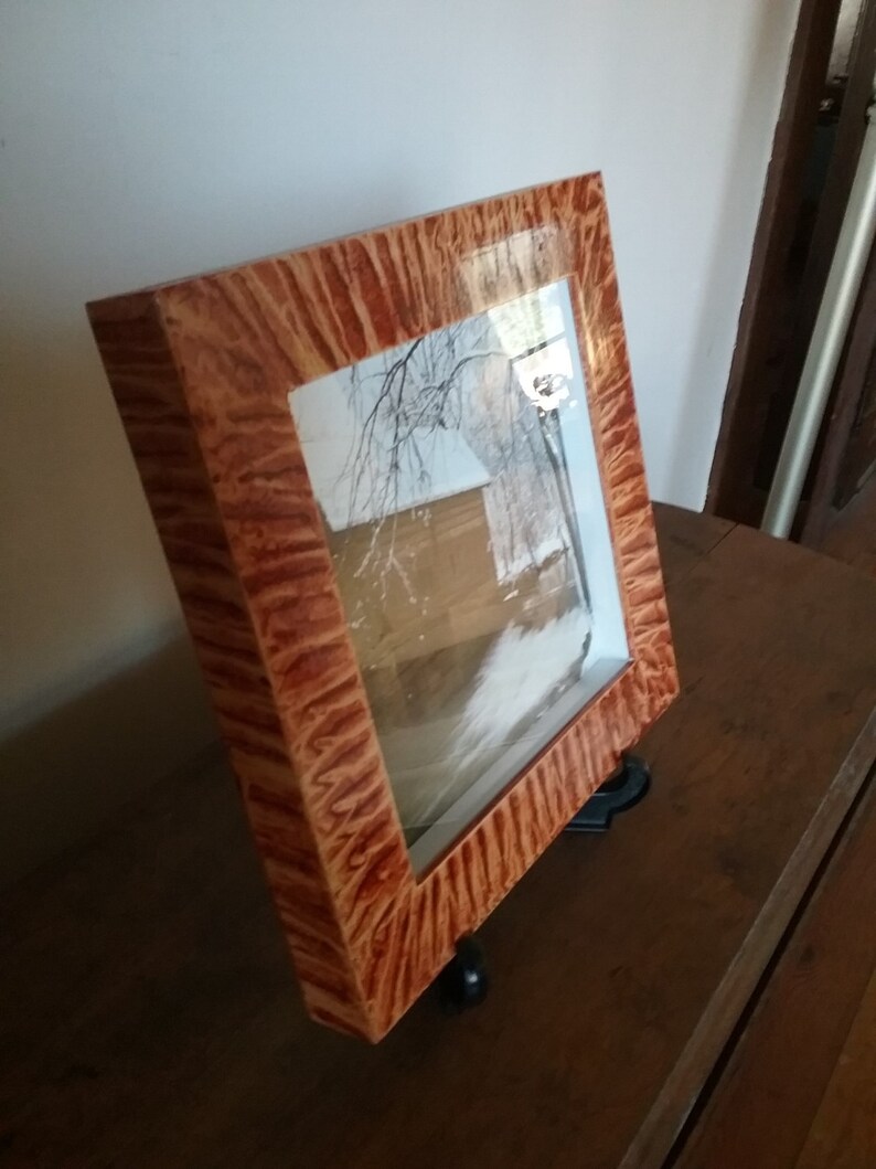 Shadowbox frame vinegar painted in coppery sienna