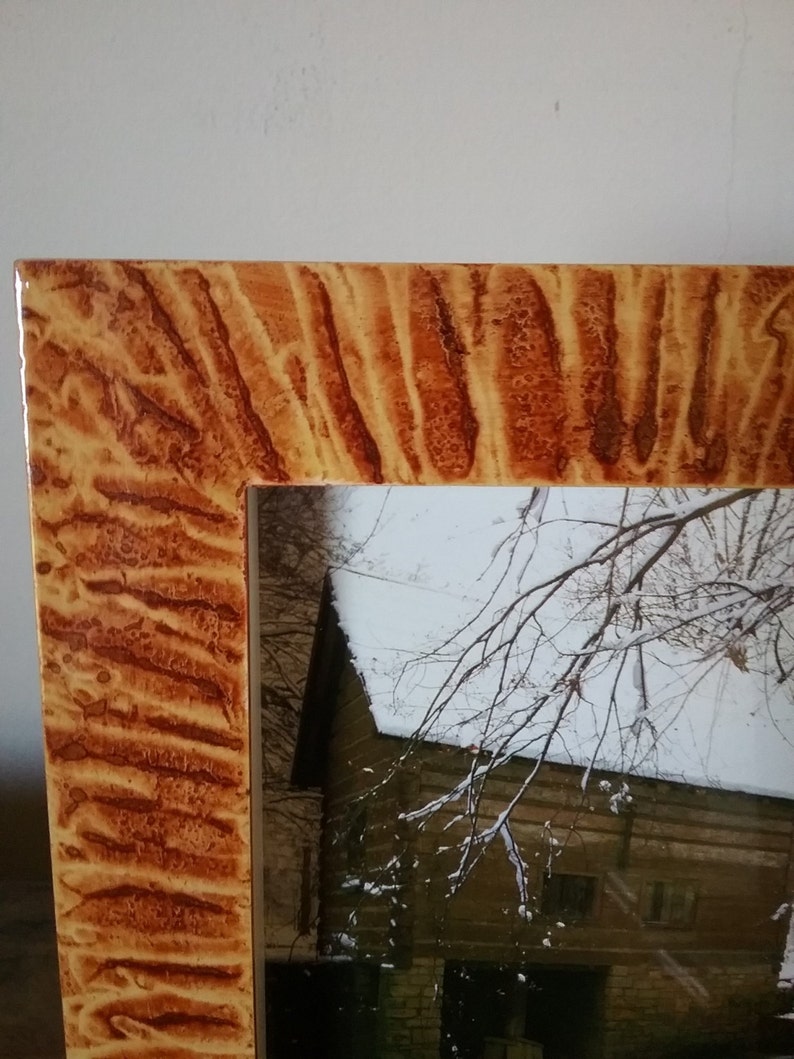 Shadowbox frame vinegar painted in coppery sienna