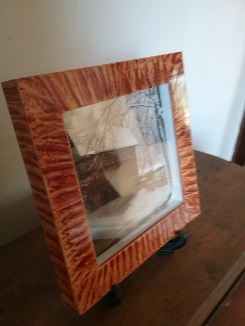 Shadowbox frame vinegar painted in coppery sienna