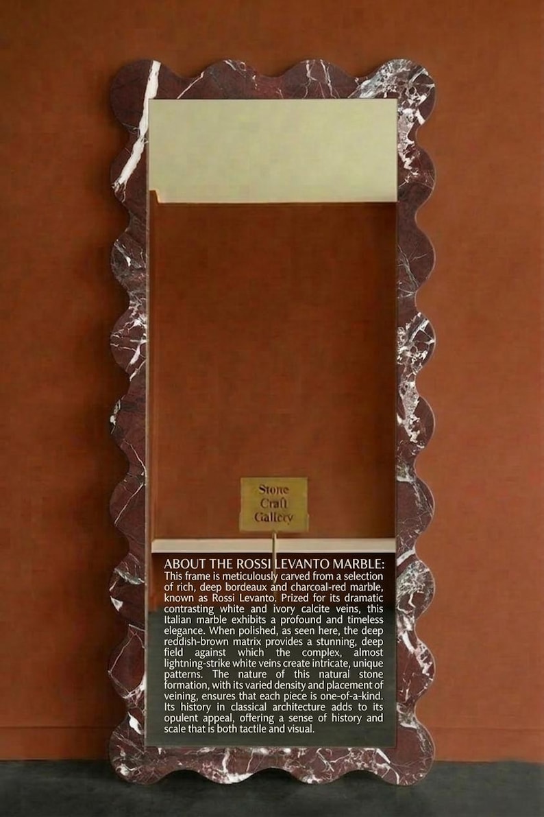 May include: A rectangular frame with a wavy edge, crafted from deep burgundy and charcoal-red marble. The frame has white and ivory veins, and a small sign that says "Stone Craft Gallery".