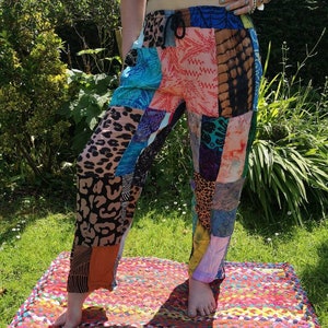 May include: Patchwork pants with a variety of colorful patterns, including floral, animal print, and tie-dye. The pants have a drawstring waist and a relaxed fit.