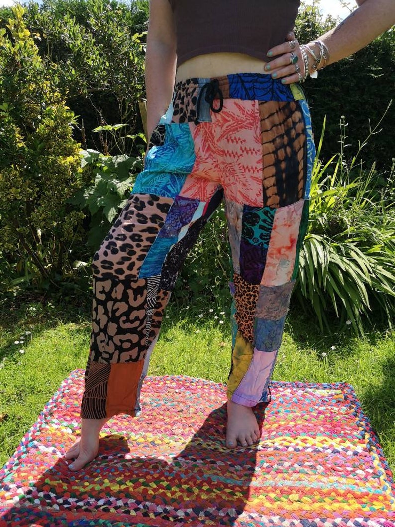 May include: Patchwork pants with a variety of colorful patterns, including floral, animal print, and tie-dye. The pants have a drawstring waist and a relaxed fit.