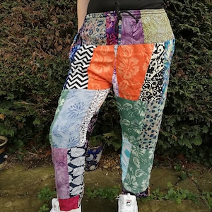 May include: Patchwork pants with a variety of colorful patterns, including floral, geometric, and animal prints. The pants have a drawstring waistband and are made of a soft, comfortable fabric.