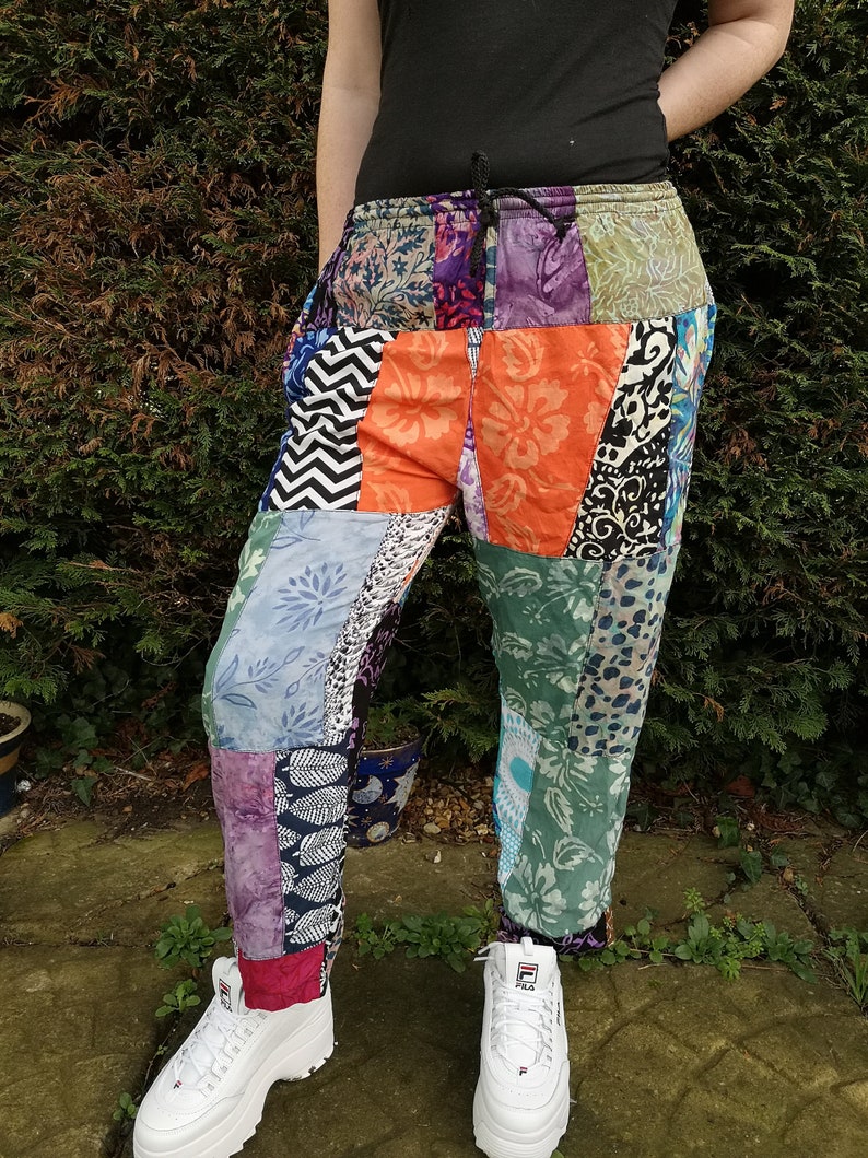 May include: Patchwork pants with a variety of colorful patterns, including floral, geometric, and animal prints. The pants have a drawstring waistband and are made of a soft, comfortable fabric.