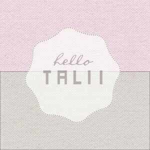 May include: A white, scalloped-edge circle with the text "hello TALI" on a pink and grey textured background.