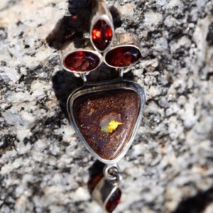 Boulder Opal and Garnet in fine Silver was 140.00