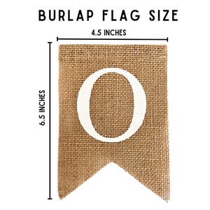 May include: A burlap flag with a white letter "O" on it. The flag is 6.5 inches tall and 4.5 inches wide.