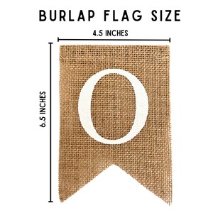 May include: A burlap flag with a white letter "O" on it. The flag is 6.5 inches tall and 4.5 inches wide.
