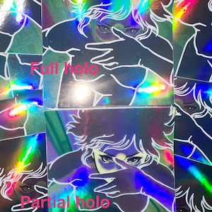 May include: Holographic stickers featuring a stylized illustration of a person with blue eyes and white hair, partially obscuring their face with a hand gesture. The stickers have a rainbow sheen and the text "Full holo" and "Partial holo".