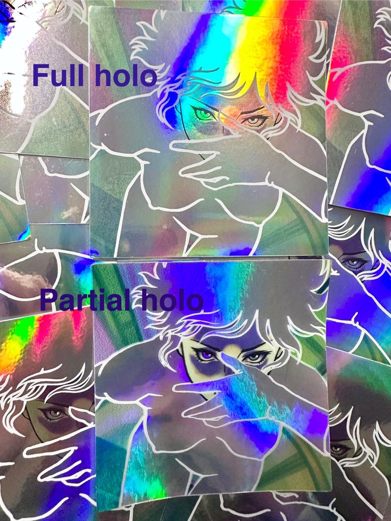 May include: Holographic stickers featuring a stylized illustration of a person with their hand covering their face. The stickers have a rainbow color effect and the text "Full holo" and "Partial holo".
