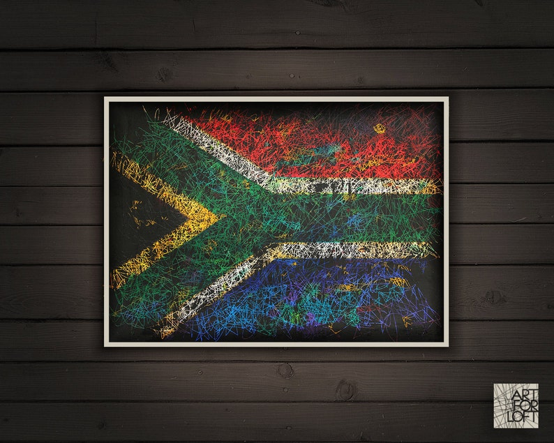 May include: Framed artwork featuring the South African flag, rendered with colorful, scribbled lines on a black background. The flag's design includes red, white, blue, yellow, and green elements, set within a white border.