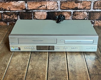 Aparelho de entretenimento doméstico 2 em 1 PHILIPS - Reprodutor combinado de VHS e DVD - Testado e funcionando!