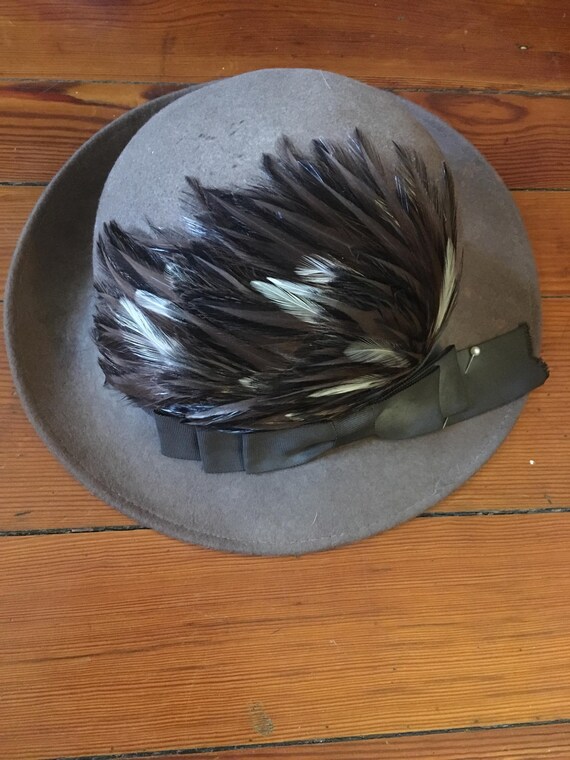 Feathered cloche hat.