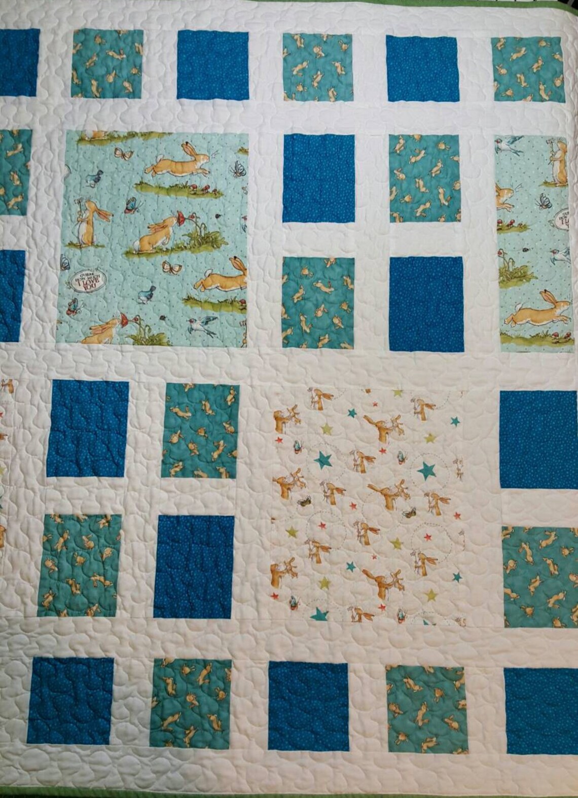 Quilt made with Guess How Much I Love You fabric in blues Etsy
