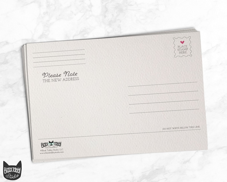 May include: A white postcard with a place to put a stamp and a line that says "Please Note The New Address".