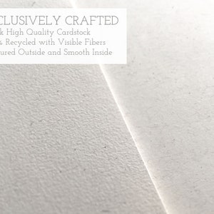May include: Close-up of a white textured cardstock. The text "EXCLUSIVELY CRAFTED" is at the top of the image. The text below reads: "&bull;Thick High Quality Cardstock &bull;100% Recycled with Visible Fibers &bull;Textured Outside and Smooth Inside"