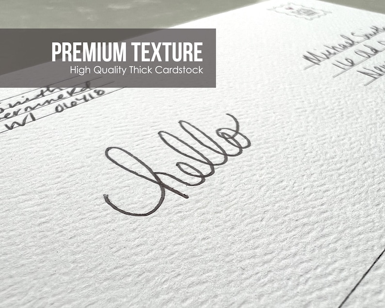 May include: Close-up of a white textured cardstock surface with the word "hello" written in black ink. The text "PREMIUM TEXTURE" and "High Quality Thick Cardstock" is printed at the top of the image.