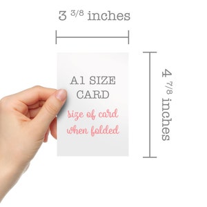 May include: A white card with the text "A1 SIZE CARD" in black and "size of card when folded" in pink. The card is 3 3/8 inches wide and 4 7/8 inches tall.
