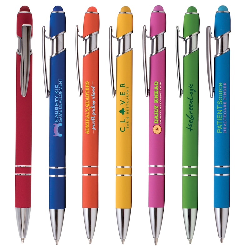 May include: A set of ten colorful pens with different company logos printed on them. The pens have a silver clip and a silver tip. The pens are arranged in a row from left to right.