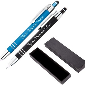 May include: Two personalized pens with black and blue barrels and silver accents come in a black box. The pens have a stylus tip and the text "Your Imprint Here" is engraved on each pen.