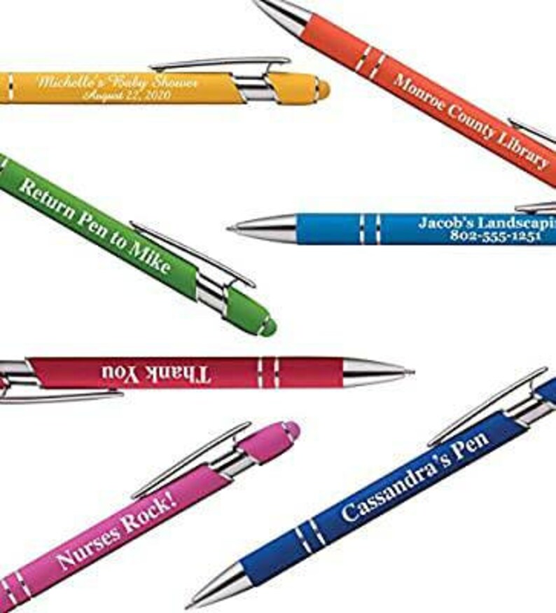 May include: Assortment of colorful pens with personalized text, including "Michelle's Baby Shower", "Return Pen to Mike", "Monroe County Library", "Jacob's Landscaping", "Thank You", "Nurses Rock!" and "Cassandra's Pen".