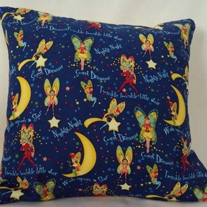 May include: A blue pillowcase with a repeating pattern of fairies, stars, and crescent moons. The pattern includes the text "Sweet Dreams", "Nighty Night", and "Wish upon a Star".