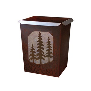 May include: A rustic metal trash can with a cutout design of three pine trees. The can has a brown, rusty finish and a silver top.