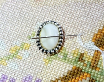 White pearlescent needle minder, needle nanny, needle keeper, magnetic, repurposed, oval, vintage