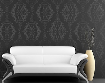May include: A white leather sofa with black trim sits in front of a black wall with a gray damask pattern. A vase with dried branches sits on the floor to the right of the sofa.