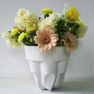 May include: A rustic wooden sign with the text "Welcome to our home" in white lettering. The sign features a distressed finish and a simple, inviting design, perfect for front door decor.