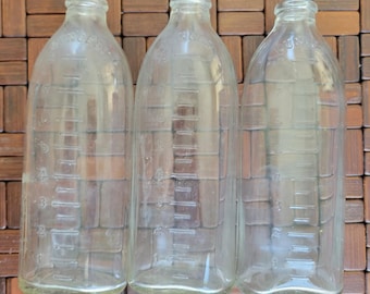 Vintage glass baby bottles - baby on belly- 8oz set of 3