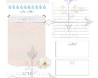 Puede incluir: Un planificador diario con un fondo de acuarela y un diseño floral. El planificador incluye secciones para "Hoy estoy agradecido por", "Por hacer", "Recordatorios", "Notas" y "Consumo de agua".
