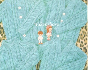May include: Four knitted sweaters in a light blue color with a cable knit pattern. The sweaters are arranged in a pile on a leopard print fabric background. The word "Makenshare" is printed on the fabric.