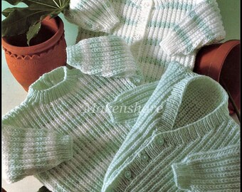 May include: Three knitted sweaters and cardigans featuring a ribbed texture. One cardigan is white with light green stripes and buttons. Another is a light green pullover, and the third is a light green cardigan with buttons. Text reads Makenshore.