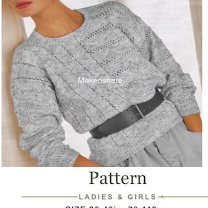 May include: A light gray long-sleeve sweater with a textured knit pattern, featuring a round neckline and ribbed cuffs. The sweater is cinched at the waist with a black belt. Text on the image reads VINTAGE KNITTING PATTERN, LADIES & GIRLS, SIZE 30-40in, 76-112cm, DK / LIGHT WORSTED / 8 PLY.