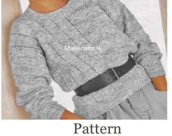 May include: A light gray long-sleeve sweater with a textured knit pattern, featuring a round neckline and ribbed cuffs. The sweater is cinched at the waist with a black belt. Text on the image reads VINTAGE KNITTING PATTERN, LADIES & GIRLS, SIZE 30-40in, 76-112cm, DK / LIGHT WORSTED / 8 PLY.