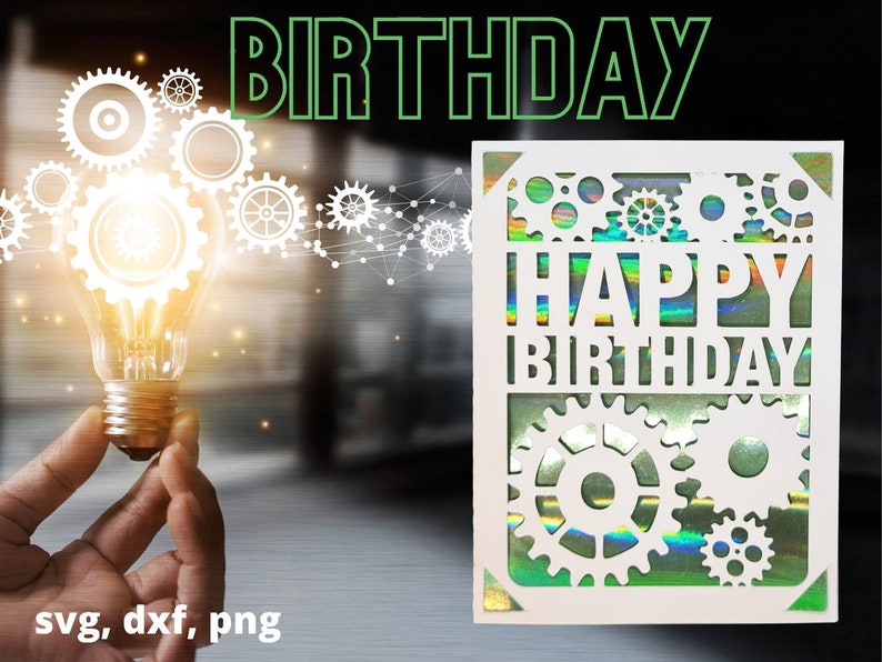 May include: A white card with a holographic finish features a cut-out design of gears and the text "Happy Birthday". The card is against a blurred background of a light bulb and gears.